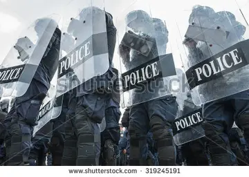 stock-photo-riot-police-used-shields-and-batons-tactical-training-319245191.jpg