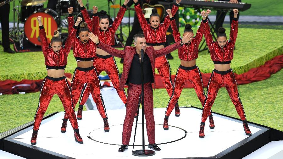 cantor-pop-robbie-williams-canta-para-publico-em-moscou-1528987300551_v2_900x506.jpg